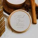 Delicate Gold and Cream Thank You Wedding Favor Classic Round Sticker<br><div class="desc">These delicate gold and cream thank you wedding favor stickers are perfect for a modern wedding reception. The romantic minimalist design features lovely and elegant champagne golden yellow typography on an ivory cream background with a clean and simple look. Personalize the sticker labels with your names, the event (if applicable),...</div>