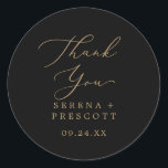 Delicate Gold Black Thank You Favor Sticker<br><div class="desc">These delicate gold and black thank you favor stickers are perfect for a modern wedding reception. The romantic minimalist design features lovely and elegant champagne golden yellow typography on a black background with a clean and simple look. Personalize the sticker labels with your names, the event (if applicable), and the...</div>