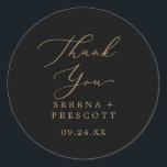 Delicate Gold Black Thank You Favor Sticker<br><div class="desc">These delicate gold and black thank you favor stickers are perfect for a modern wedding reception. The romantic minimalist design features lovely and elegant champagne golden yellow typography on a black background with a clean and simple look. Personalize the sticker labels with your names, the event (if applicable), and the...</div>