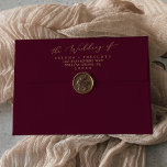Delicate Gold Burgundy Wedding Invitation Envelope<br><div class="desc">This delicate gold burgundy wedding invitation envelope is perfect for a modern wedding. The romantic minimalist design features lovely and elegant champagne golden yellow typography on a burgundy red background with a clean and simple look. Personalize the envelope flap with your return address.</div>