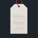 Delicate Gold Calligraphy | Cream Wedding Welcome Gift Tags<br><div class="desc">These delicate gold calligraphy cream wedding welcome gift tags are perfect for a modern wedding. The romantic minimalist design features lovely and elegant champagne golden yellow typography on an ivory cream background with a clean and simple look. Personalize the tags with the location of your wedding, a short welcome note,...</div>