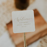 Delicate Gold Calligraphy | Cream Wedding Welcome Square Sticker<br><div class="desc">These delicate gold calligraphy cream wedding welcome stickers are perfect for a modern wedding. The romantic minimalist design features lovely and elegant champagne golden yellow typography on an ivory cream background with a clean and simple look. Personalize these stickers with the location of your wedding, names, and wedding date. These...</div>