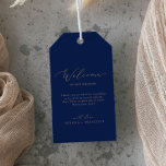 Delicate Gold Calligraphy | Navy Wedding Welcome Gift Tags<br><div class="desc">These delicate gold calligraphy navy wedding welcome gift tags are perfect for a modern wedding. The romantic minimalist design features lovely and elegant champagne golden yellow typography on a navy blue background with a clean and simple look. Personalize the tags with the location of your wedding, a short welcome note,...</div>