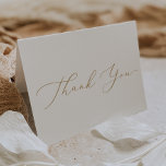 Delicate Gold Calligraphy Thank You Card<br><div class="desc">This delicate gold calligraphy thank you card is perfect for a modern wedding. The romantic minimalist design features lovely and elegant champagne golden yellow typography on a white background with a clean and simple look. Personalize the inside of the card with your names, and a thank you message. Alternatively, leave...</div>