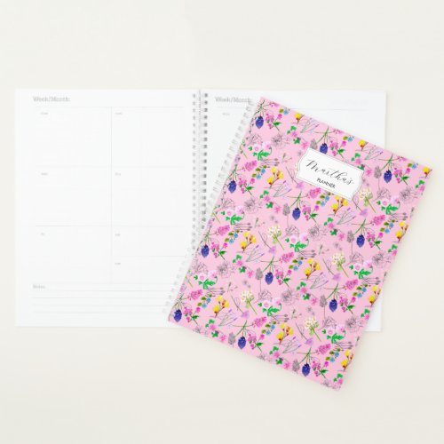Delicate watercolour wildflowers on pink planner