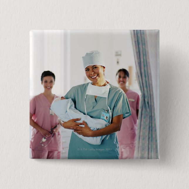 Delivery room nurse holding baby, nurses in pinback button (Front)