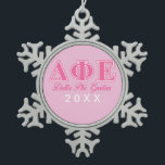 Delta Phi Epsilon Pink Letters Snowflake Pewter Christmas Ornament<br><div class="desc">Check out these official Delta Phi Epsilon designs! Personalize your own Greek merchandise on Zazzle.com! Click the Customize button to insert your own name, class year, or club to make a unique product. Try adding text using various fonts & view a preview of your design! Zazzle's easy to customize products...</div>