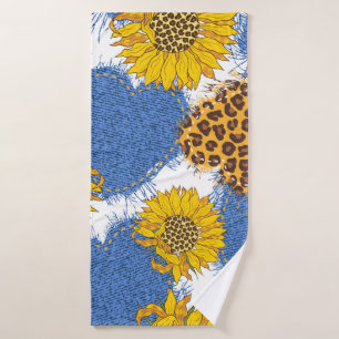 Denim hearts made of fabric with torn edges and le bath towel