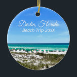 Destin Florida Beach Vacation Keepsake Christmas Ceramic Ornament<br><div class="desc">This beautiful Destin Florida beach vacation keepsake Christmas ornament features the pretty blue green ocean waters of Sandestin along the coast. Pretty teal and blue umbrellas line the summer seashore in front of the sea grass. Lovely white cursive script for my favorite seaside city along the emerald coast. Customize with...</div>