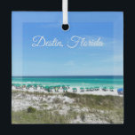 Destin Florida Coast Beach Umbrellas Photography Glass Ornament<br><div class="desc">This beautiful Destin Florida beach Christmas ornament features the pretty blue green ocean waters of Sandestin along the coast. Pretty teal and blue umbrellas line the summer seashore in front of the sea grass. Lovely white cursive script for my favorite seaside city along the emerald coast.</div>