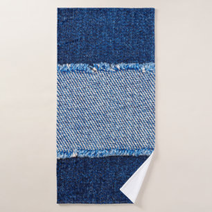 Destroyed torn denim blue jeans fabric frame on bl bath towel