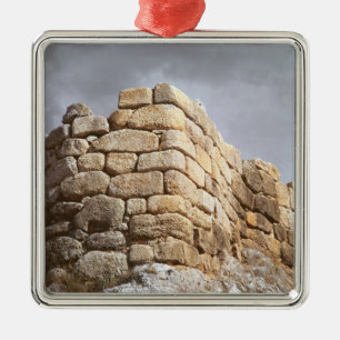 Detail of a stone wall metal ornament