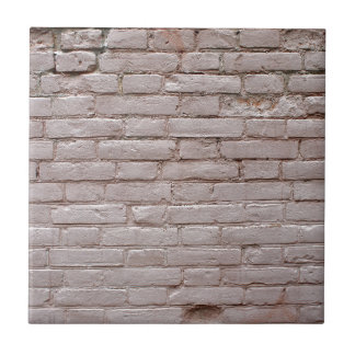 Detail of a wall of the old beige clay bricks ceramic tile