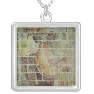 Detail of an archer from a frieze silver plated necklace