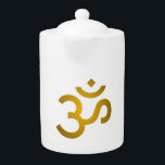 Devanagari om - White Teapot<br><div class="desc">Featuring intricate detailing around the Om symbol, each piece is thoughtfully designed to capture attention while radiating positive energy. The soft golden color adds a touch of sophistication that complements any outfit or accessory.</div>