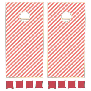 Diagonal pattern of pink and white stripes cornhole set