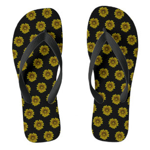 diagonal small yellow sunflowers against black flip flops