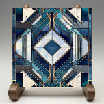 Diamond Deco Dream Ceramic Tile<br><div class="desc">Reflecting the exuberance of Art Deco design, this ceramic tile features a striking diamond motif at its center, framed by angular lines and a spectrum of blue, from the lightest sky to the deepest navy. Accents of ivory and cream intersect with the blues, creating a sense of depth and sophistication,...</div>