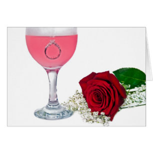 diamond ring in drink with rose cards