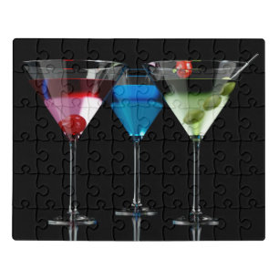 Different cocktails in martini glasses on black jigsaw puzzle