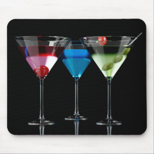 Different cocktails in martini glasses on black mouse pad
