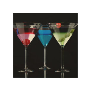Different cocktails in martini glasses on black wood wall art