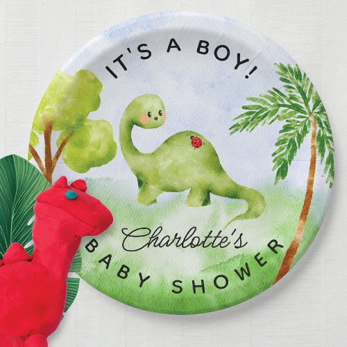 Dino Delight Baby Shower Paper Plates -  Introducing our adorable baby shower Dino design featuring a captivating watercolor illustration of dinosaurs and trees. This charming design is perfect for welcoming your little one into the world. The vibrant colors and whimsical artwork create a delightful atmosphere, setting the tone for a fun-filled celebration. With its high-quality print and attention to detail, this design is sure to impress your guests and make your baby shower a memorable event.
