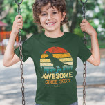 Dinosaur Birthday Boy Awesome Since Birth Year T-Shirt<br><div class="desc">Does your little boy or girl love dinosaurs? This custom shirt is perfect! There's a big T-Rex dino saying RAWR on top of a distressed rainbow background. All text is editable and currently says Awesome Since 2015 and the young kid's name. Substitute with your child's name and birth year for...</div>