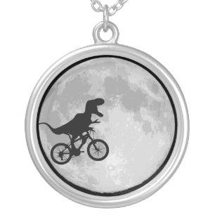 Dinosaur on a bike moon silver plated necklace