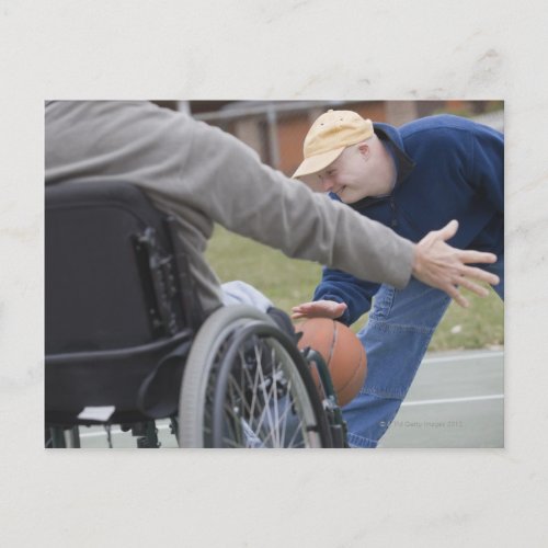 Disabled man playing basketball with his son postcard