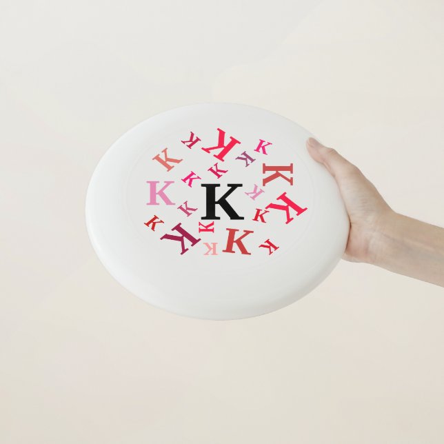 Disk - Dizzy Letters in Red Wham-O Frisbee (In Hand)