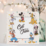 Disney's Mickey & Friends Character Birthday Foam Board<br><div class="desc">This Disney-themed "Gift Table" sign features Mickey Mouse and his iconic friends in a vibrant and cheerful design. Surrounding the playful "Gift Table" text in the center are colorful illustrations of Minnie Mouse, Donald Duck, Daisy Duck, Goofy, and Pluto, all posed in their classic playful stances. The soft, multicolored confetti-like...</div>