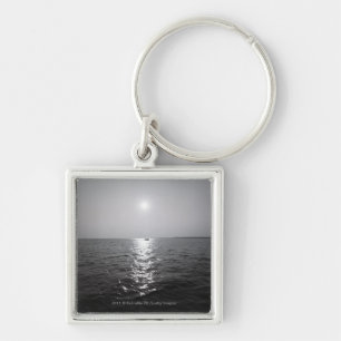 Distant boat on ocean keychain