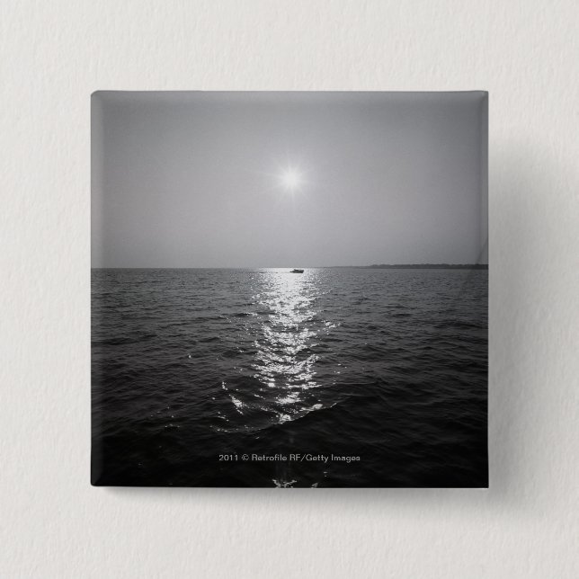 Distant boat on ocean pinback button (Front)