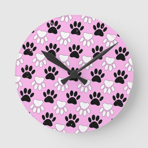 Distressed Black And White Paws On Pink Background Round Clock