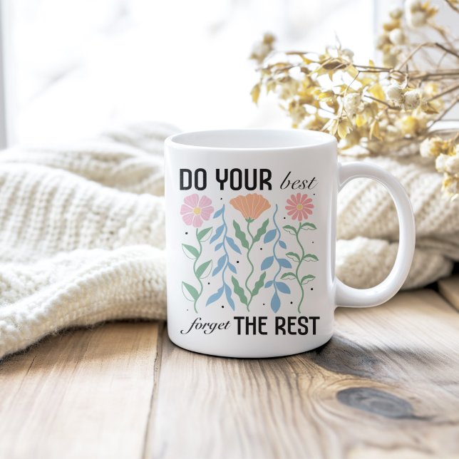 "Do Your Best Forget the Rest" Retro Floral Coffee Mug ("Do Your Best Forget the Rest" Retro Floral Coffee Mug on a neutral cozy wooden table.)