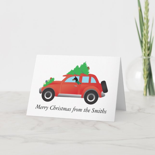Doberman Pinscher driving car w/ Christmas tree Holiday Card (Front)