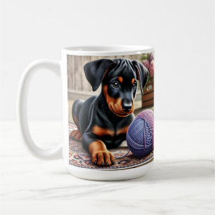 Doberman Puppy with Yarn Ball on a Colorful Rug Coffee Mug