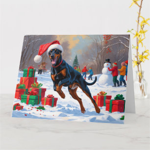 Doberman Running in Snow with Christmas Hat Card