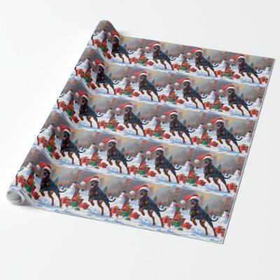 Doberman Running in Snow with Christmas Hat Wrapping Paper