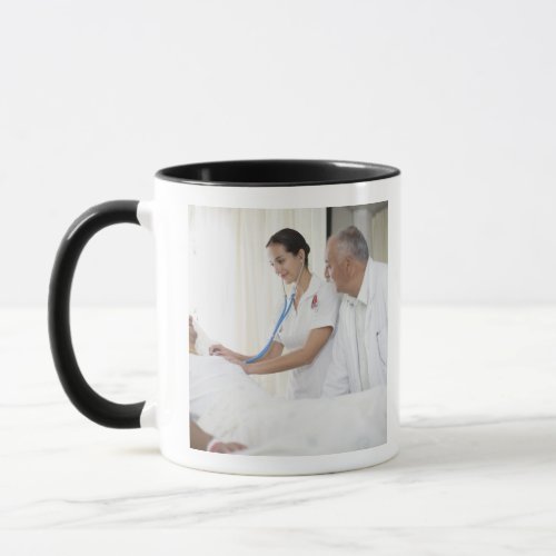 Doctor and nurse tending to patient mug