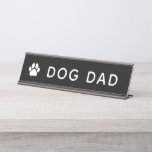 Dog Dad Paw Print Funny Office Desk Name Plate<br><div class="desc">A fun desk name plate featuring "Dog Dad" in bold white type with a paw print accent on a black background. A playful way for proud dog dads to show off their most important title at the office, home workspace, or anywhere they sit. A great gift for Father's Day, birthdays,...</div>