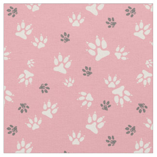 Dog footprints on a pink background Fabric