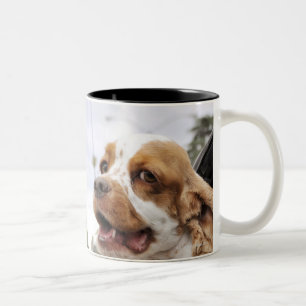 Dog hanging head out of car window Two-Tone coffee mug