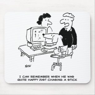 Dog is Playing at a Computer Mouse Pad