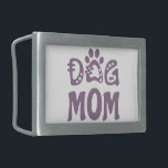 Dog Mom Belt Buckle<br><div class="desc">Celebrate your love for your furry friend with “Dog Mom Design” Charming design features a bold “Dog Mom” text accompanied by an adorable paw icon, making it the perfect choice for all proud dog moms. “This design is customizable. Click the ‘Edit Design’ button to personalize the design. You can change...</div>