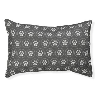 Dog or cat paws with heart on gray pet bed