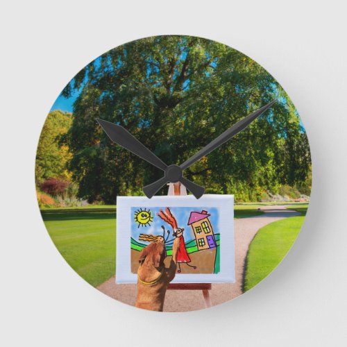 Dog Painting a Cartoon with brush in Garden Round Clock