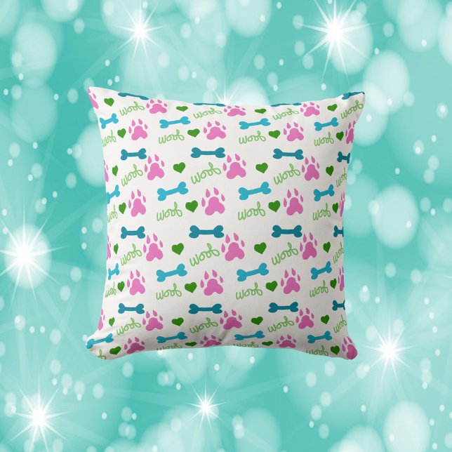 Dog Paw Bone Woof Pink Teal Green Throw Pillow (A cute throw pillow featuring pink dog paws, blue bones and green woofs.)