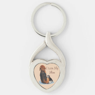 dog picture of cute puppy cuddling mom keychain